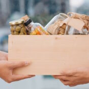 Volunteers with donation box with foodstuffs